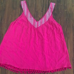 Fuschia top with Pom Pom fringe.